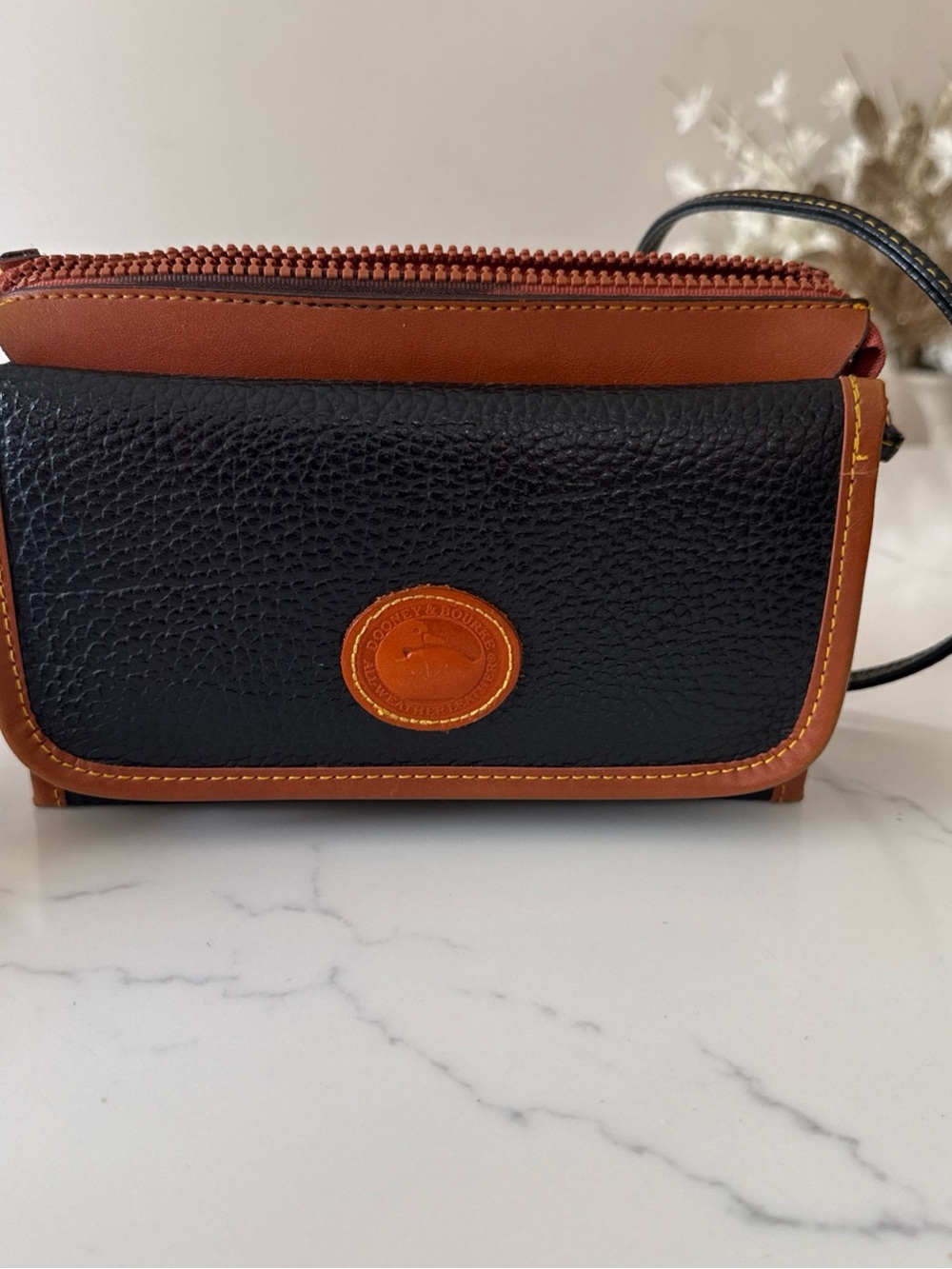Dooney & Bourke Black with Brown Trim Pebbled Leather Crossbody